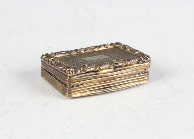 A George IV silver gilt rectangular vinaigrette with cast foliate