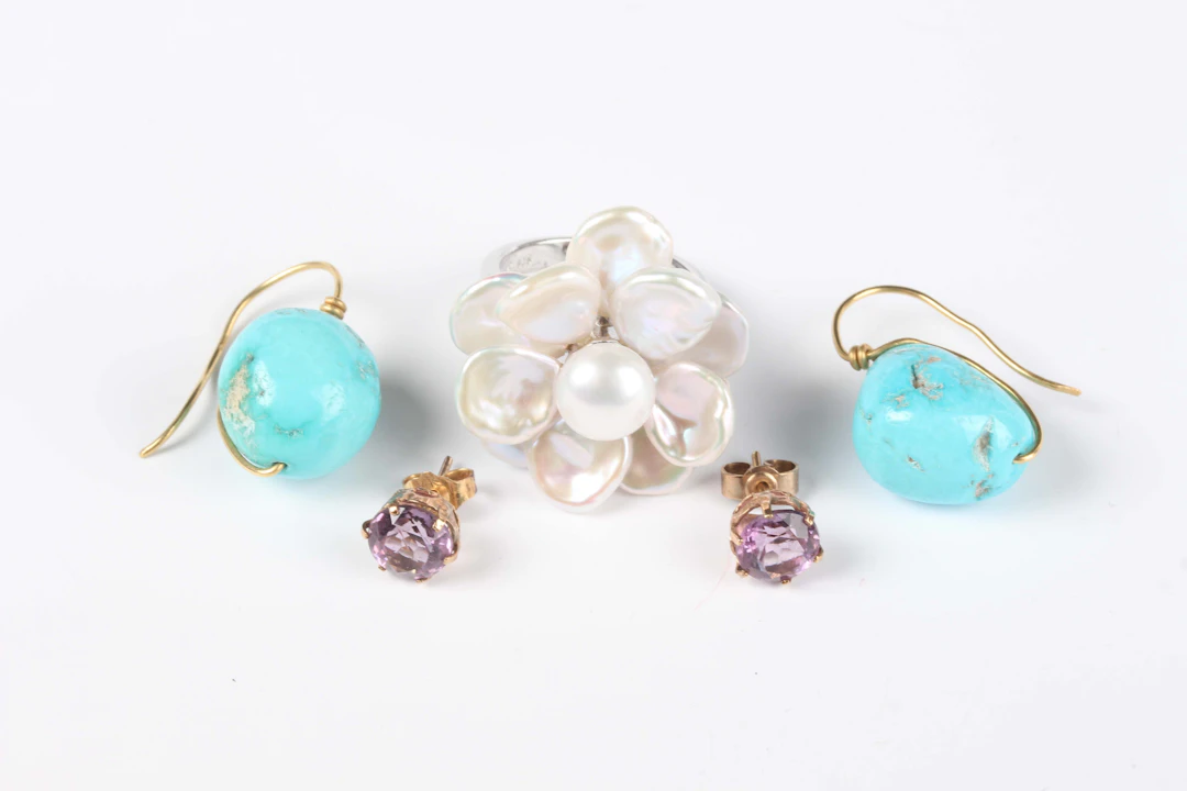 A pair of turquoise single stone earrings with wire fittings, length