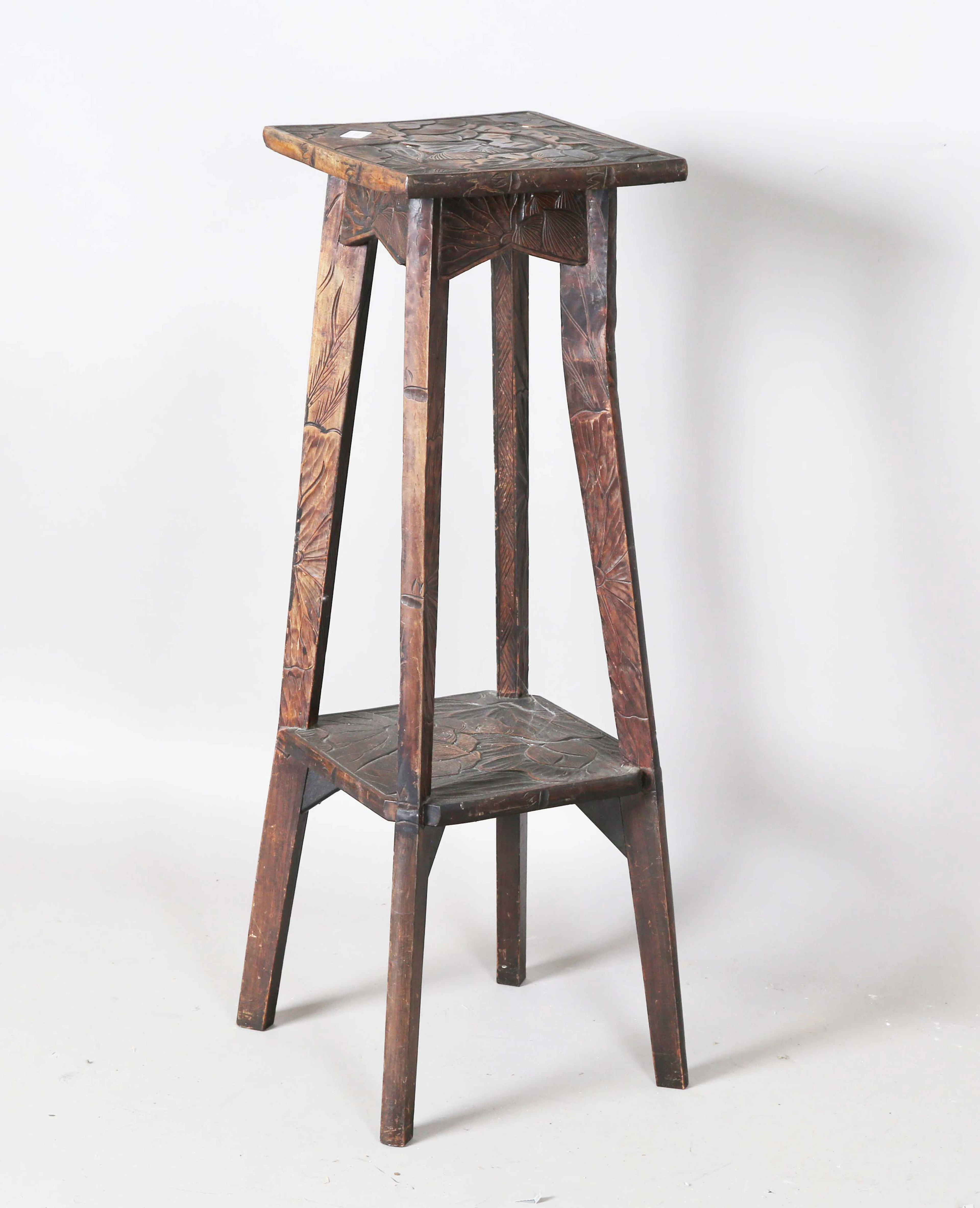 An early 20th century japonaiserie carved softwood two-tier jardinière