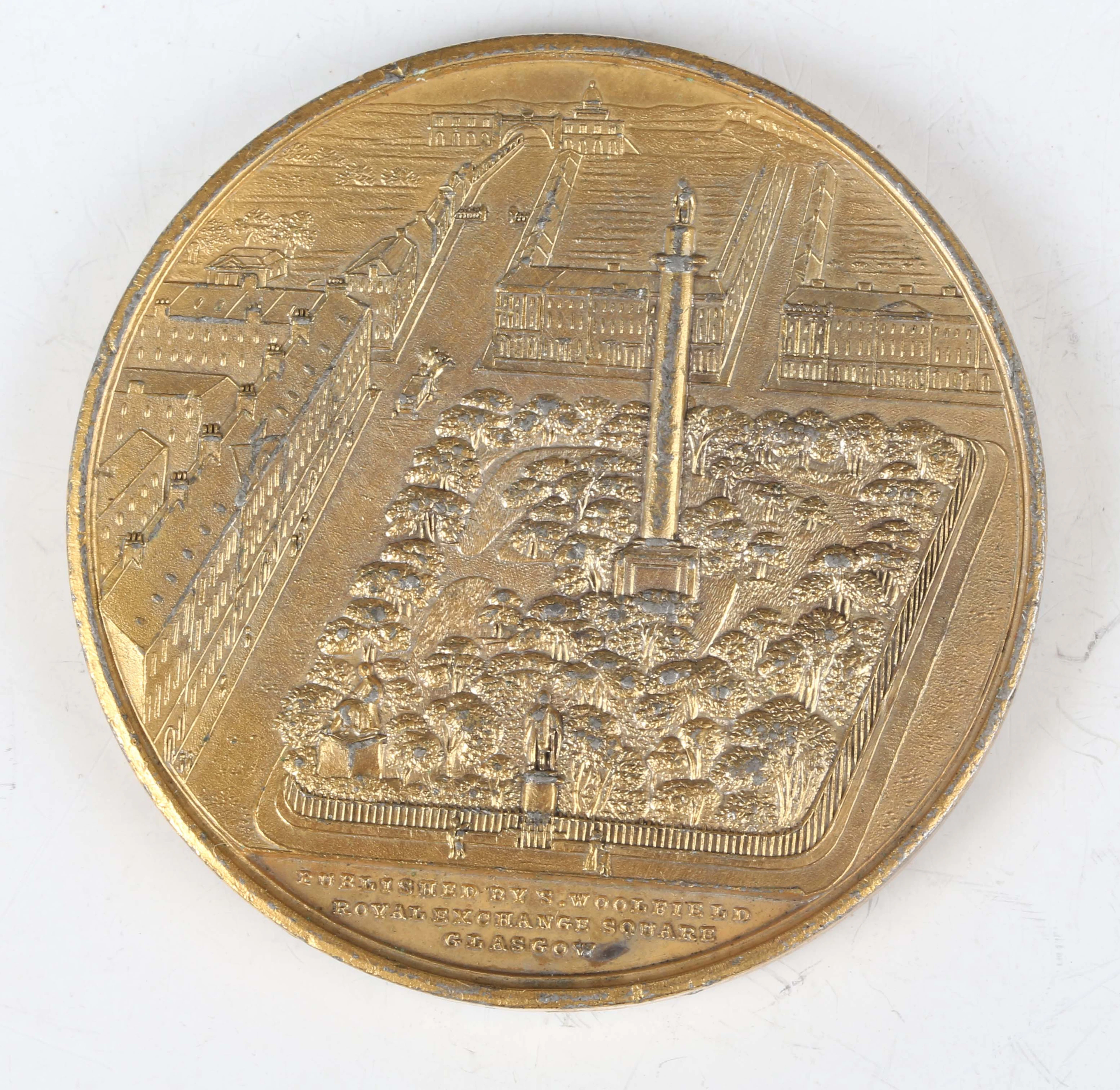 A 19th century gilt white metal medallion commemorating the opening