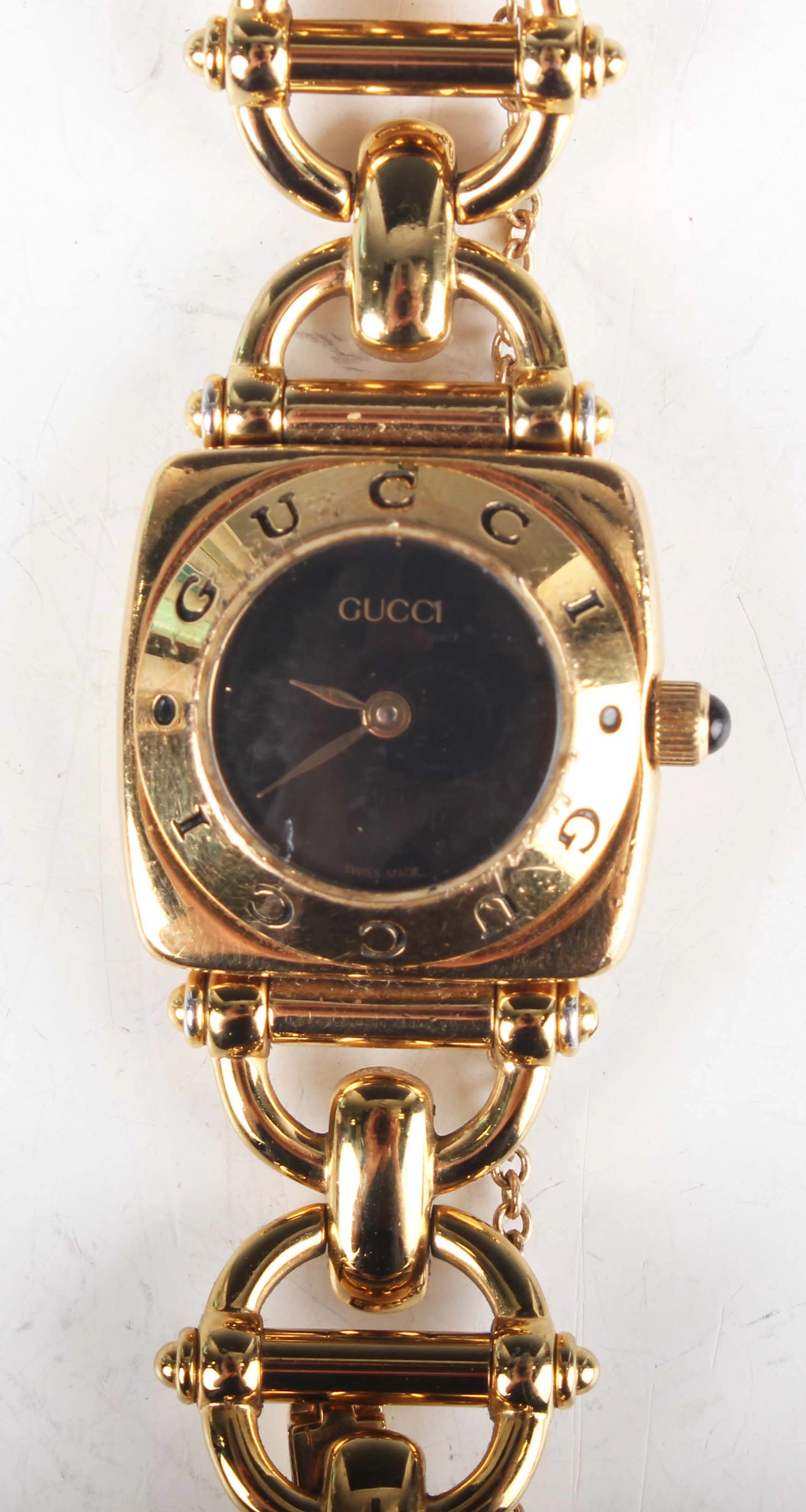 A Gucci gilt metal lady's bracelet wristwatch, Ref. 6400L, with quartz