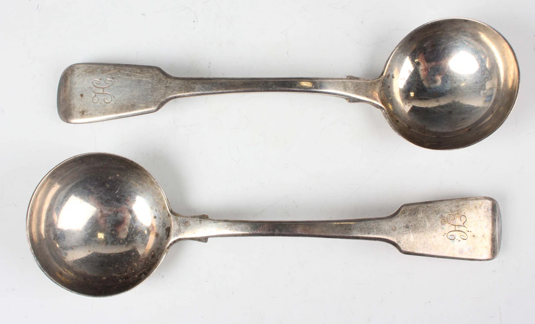 A pair of William IV silver Fiddle pattern sauce ladles, London 1835