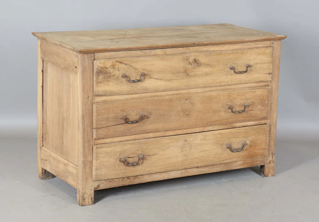 A 19th century French chestnut three-drawer commode, height 80cm