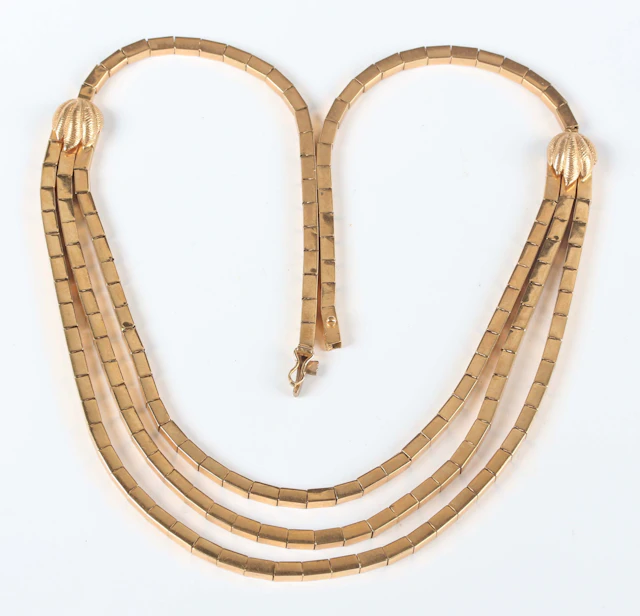 A gold rectangular bar link necklace, the front in a graduated three