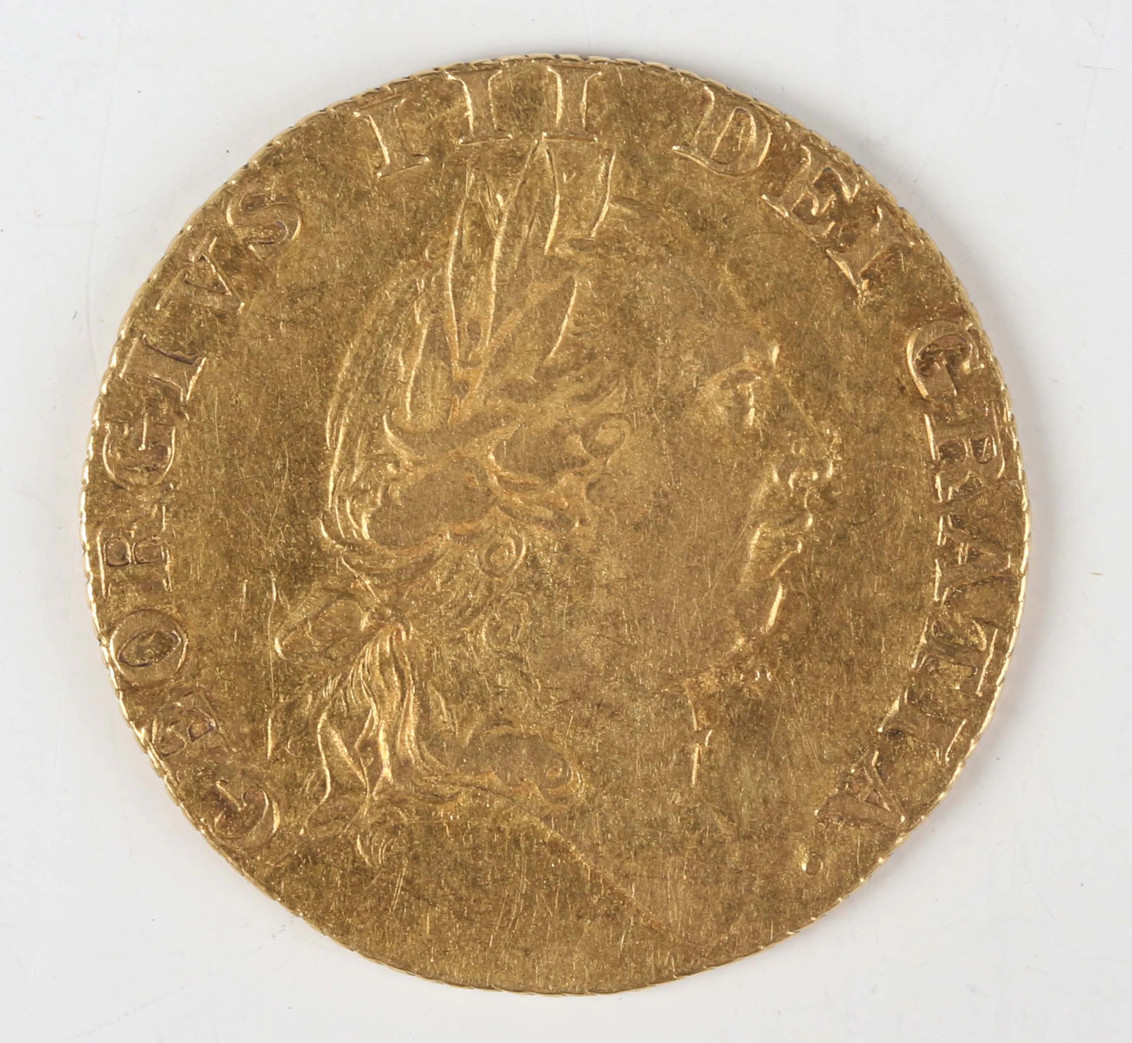 A George III spade guinea 1787, fifth laureate head, Sp 3729.