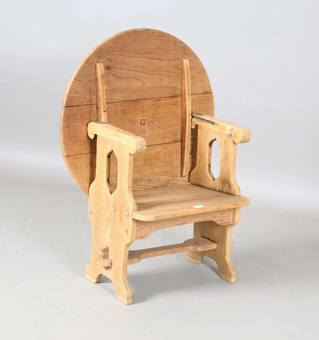 An early 20th century Arts and Crafts style washed ash monk's seat