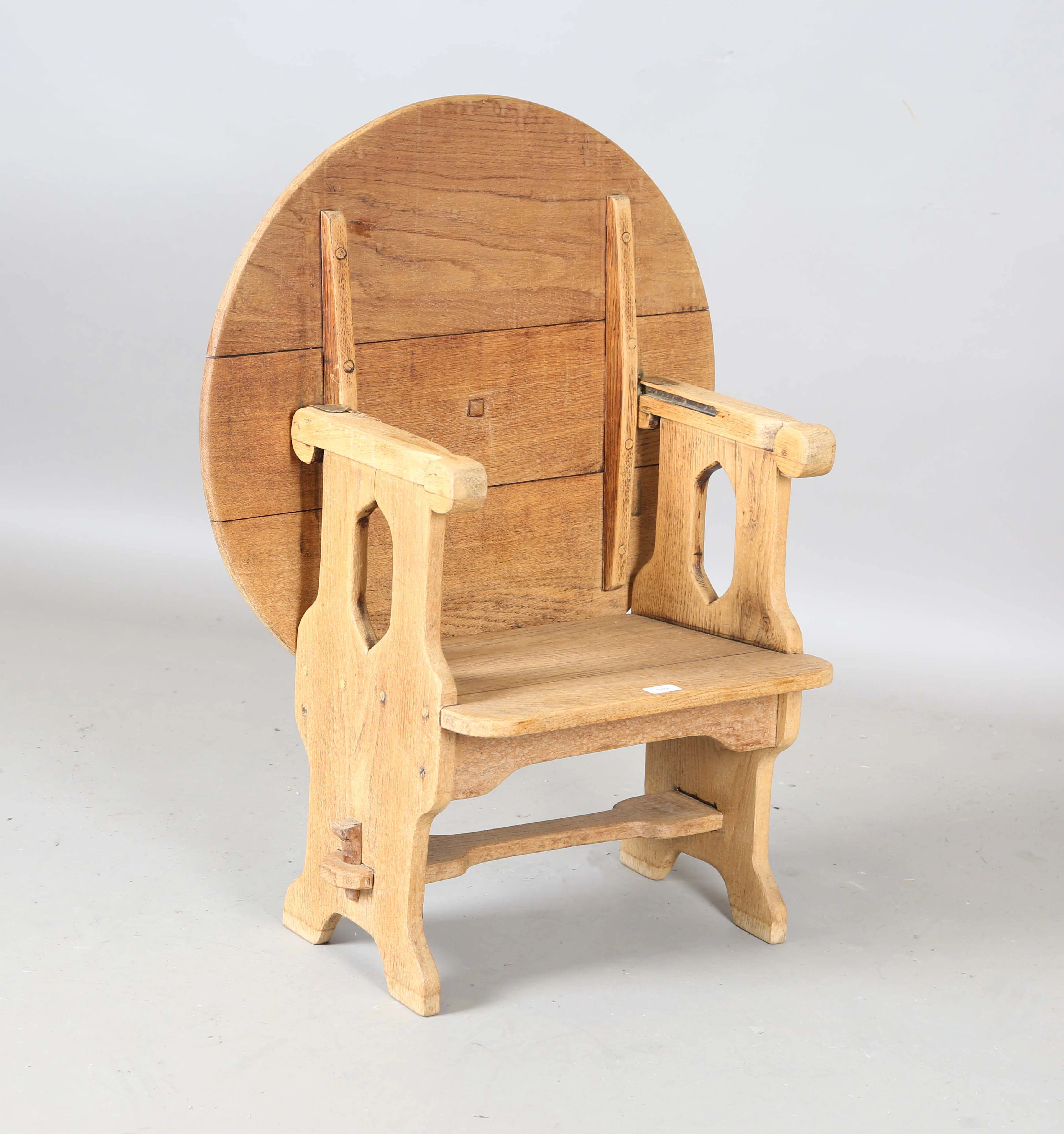 An early 20th century Arts and Crafts style washed ash monk's seat
