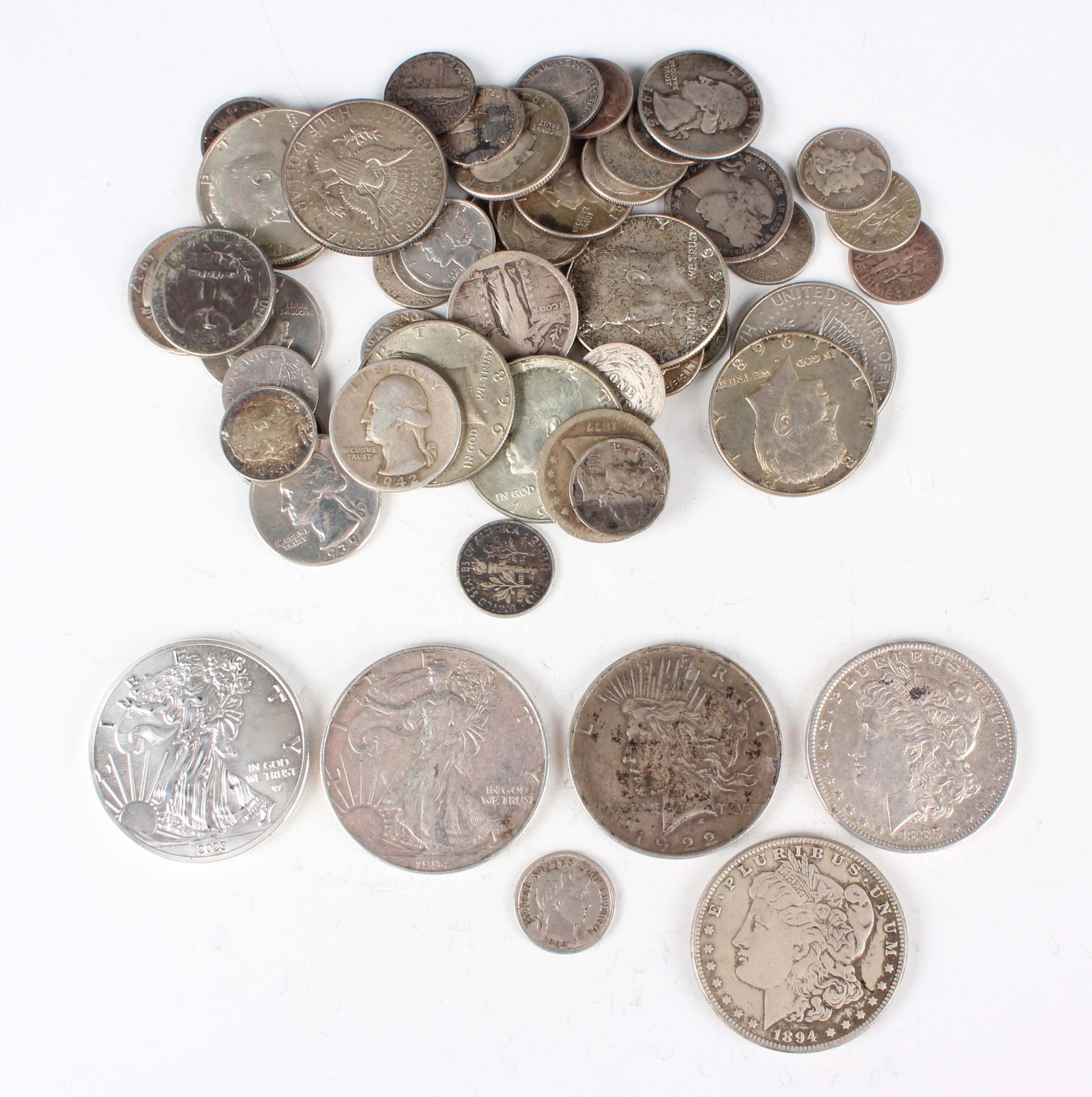 A small collection of USA silver and base metal coinage, including