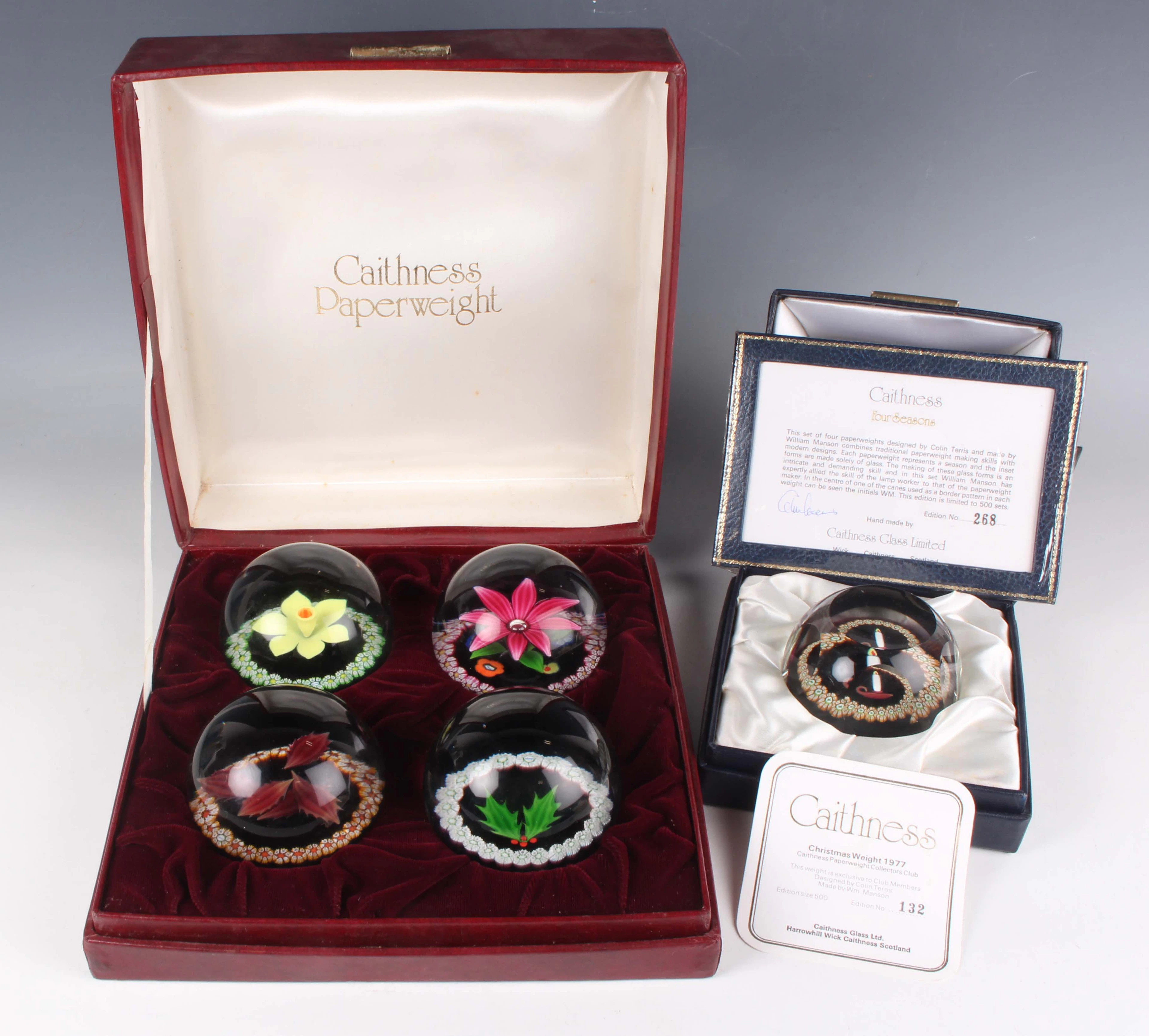 A set of four limited edition Caithness glass paperweights representing
