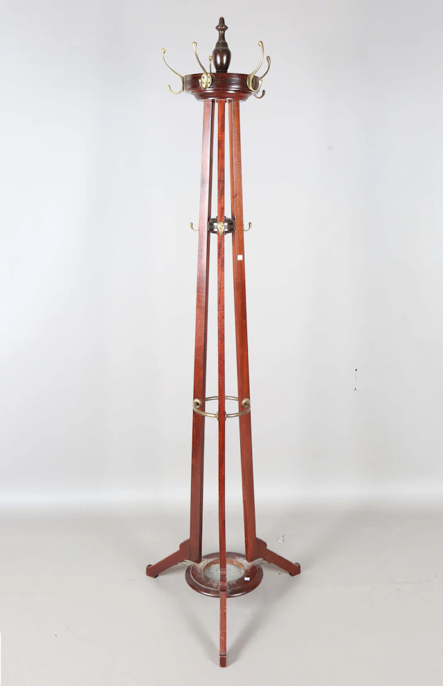 An Edwardian walnut framed hallstand, on three shaped supports, height 206cm.