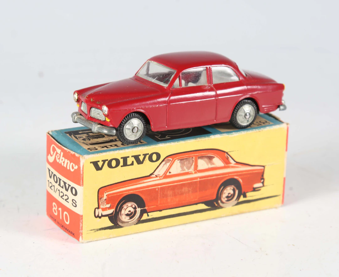 A Tekno No. 810 Volvo 121/122 S in burgundy with cast hubs, boxed