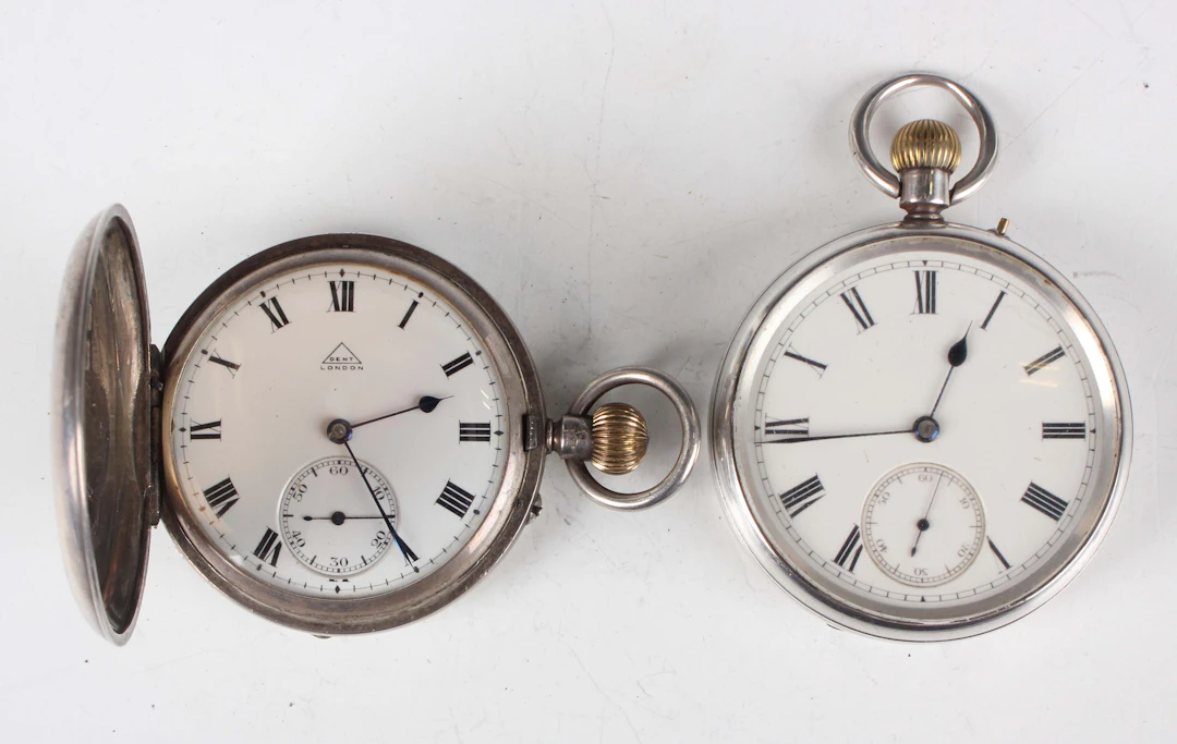 A Dent London silver hunting cased keyless wind gentleman's pocket
