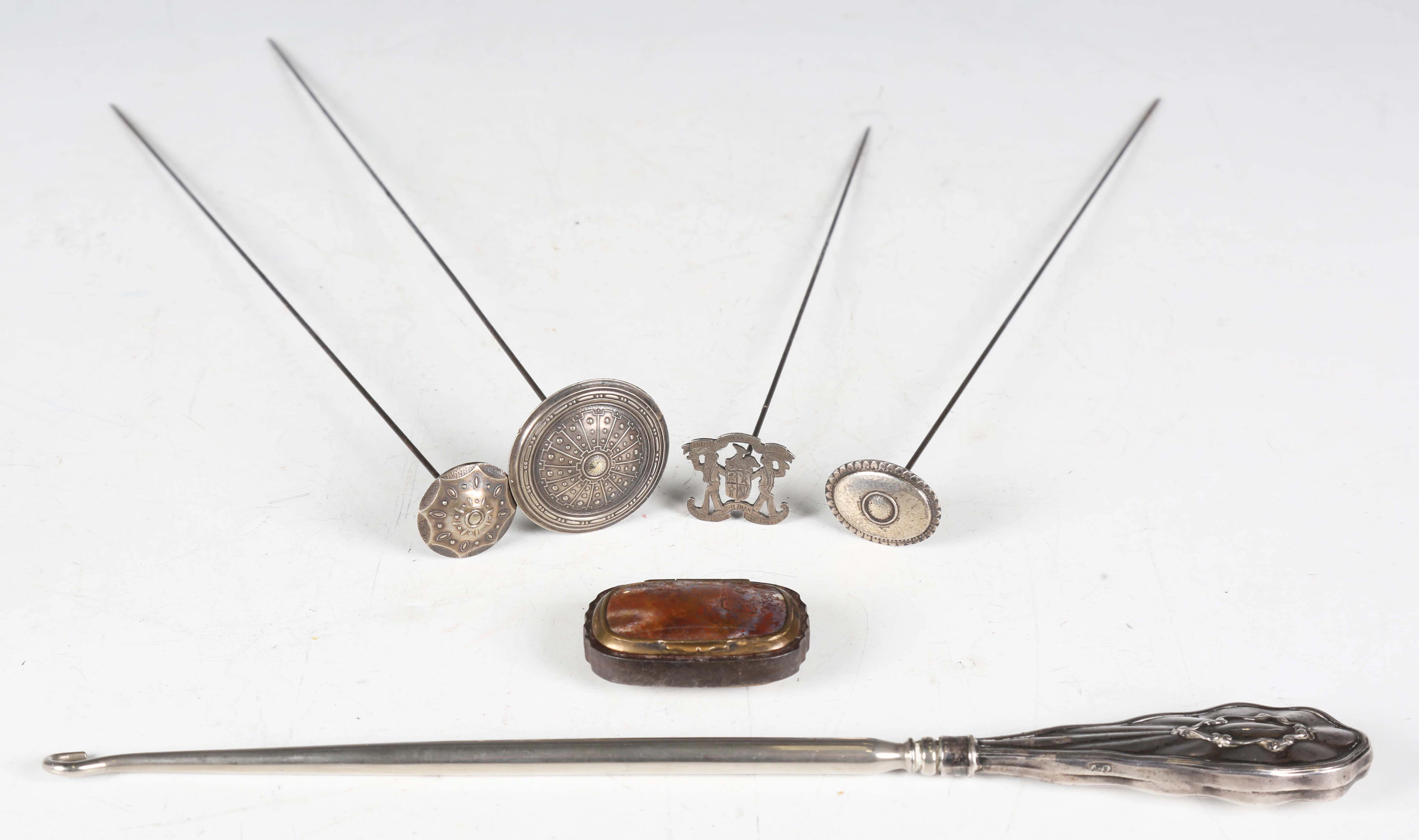 A group of five early 20th century silver mounted hatpins and an 18th