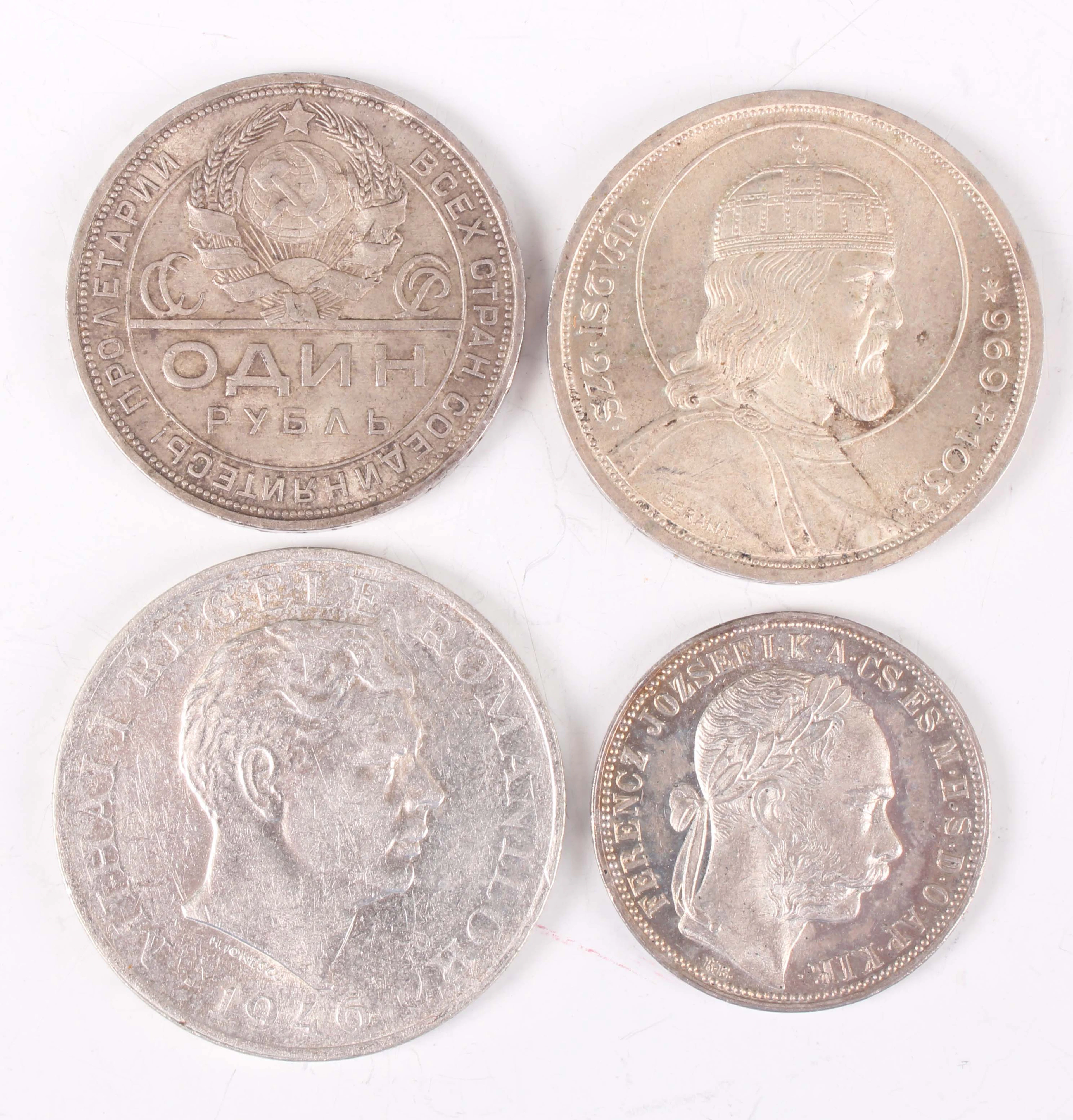 A group of four European silver coins, comprising a Russia one rouble