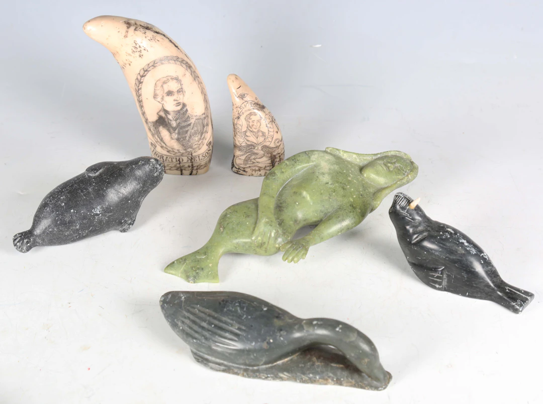A mid-20th century Canadian Inuit carved stone model of a seal, inscribed