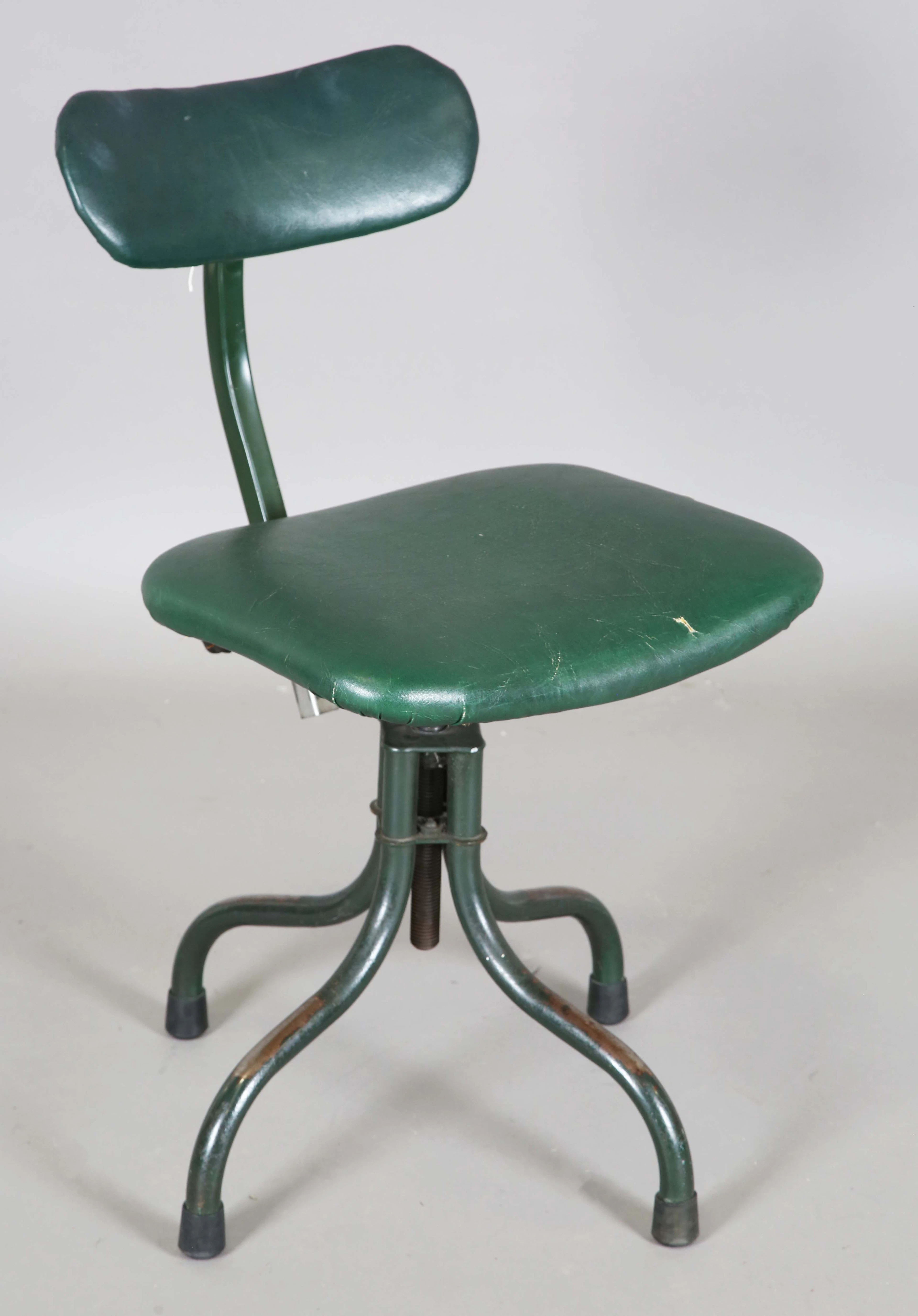A mid-20th century green painted Tan-Sad industrial swivel chair with
