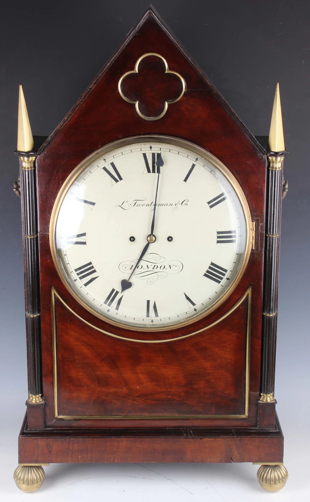 An impressive Regency brass mounted mahogany bracket clock with eight