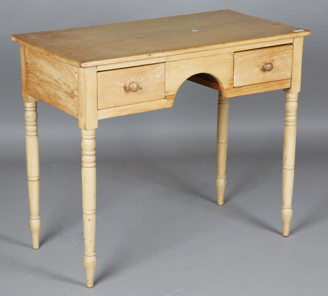 An early Victorian pine side table, fitted with two drawers, on turned