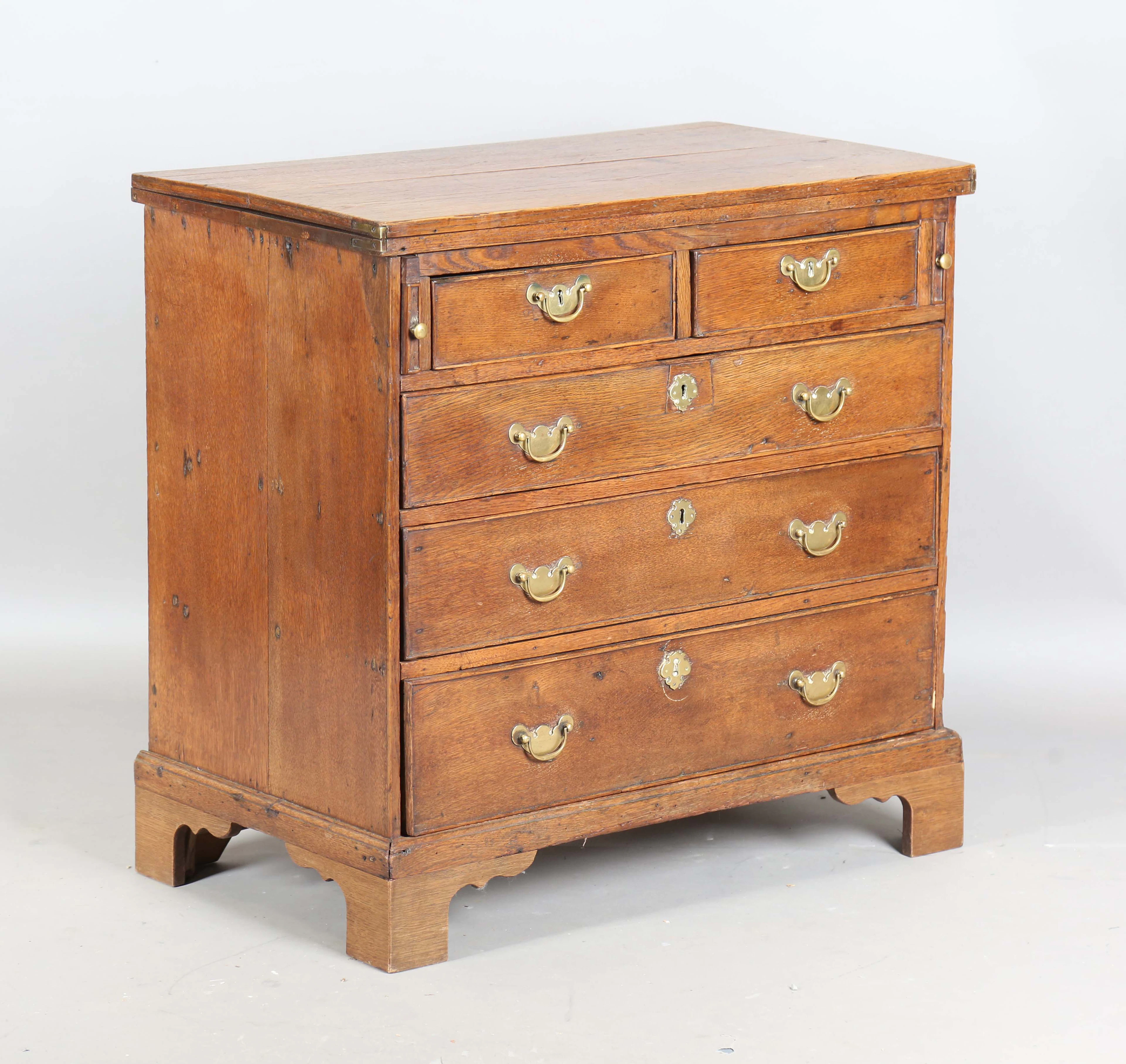 A George III provincial oak bachelor's chest of two short and three