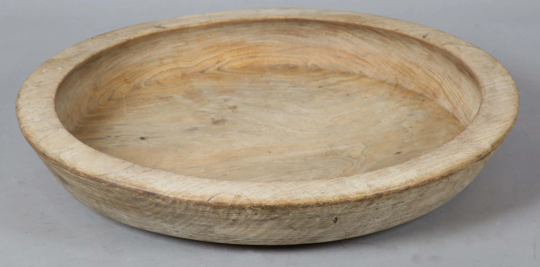 A large 19th century washed elm dairy bowl, diameter 60cm.