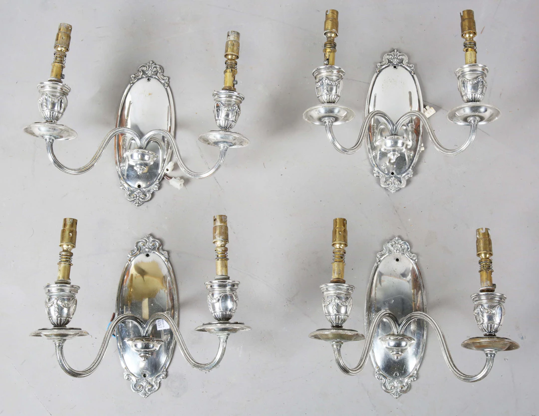 A set of four Edwardian Neoclassical Revival silver plated twin-light