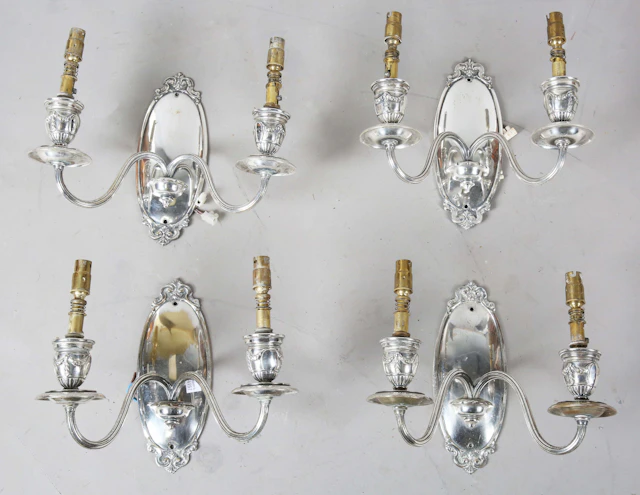 A set of four Edwardian Neoclassical Revival silver plated twin-light