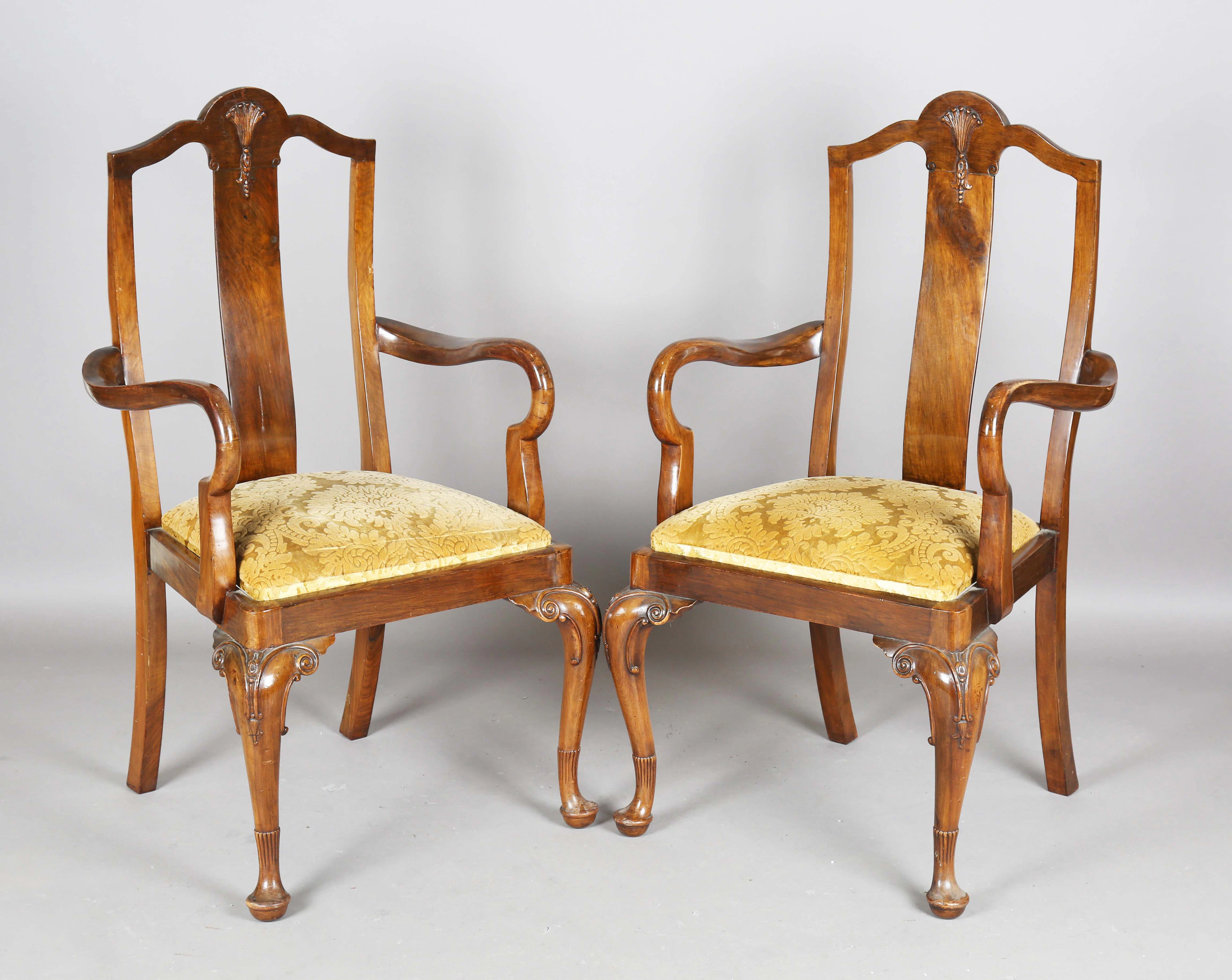 An early 20th century Queen Anne style walnut dining room suite by