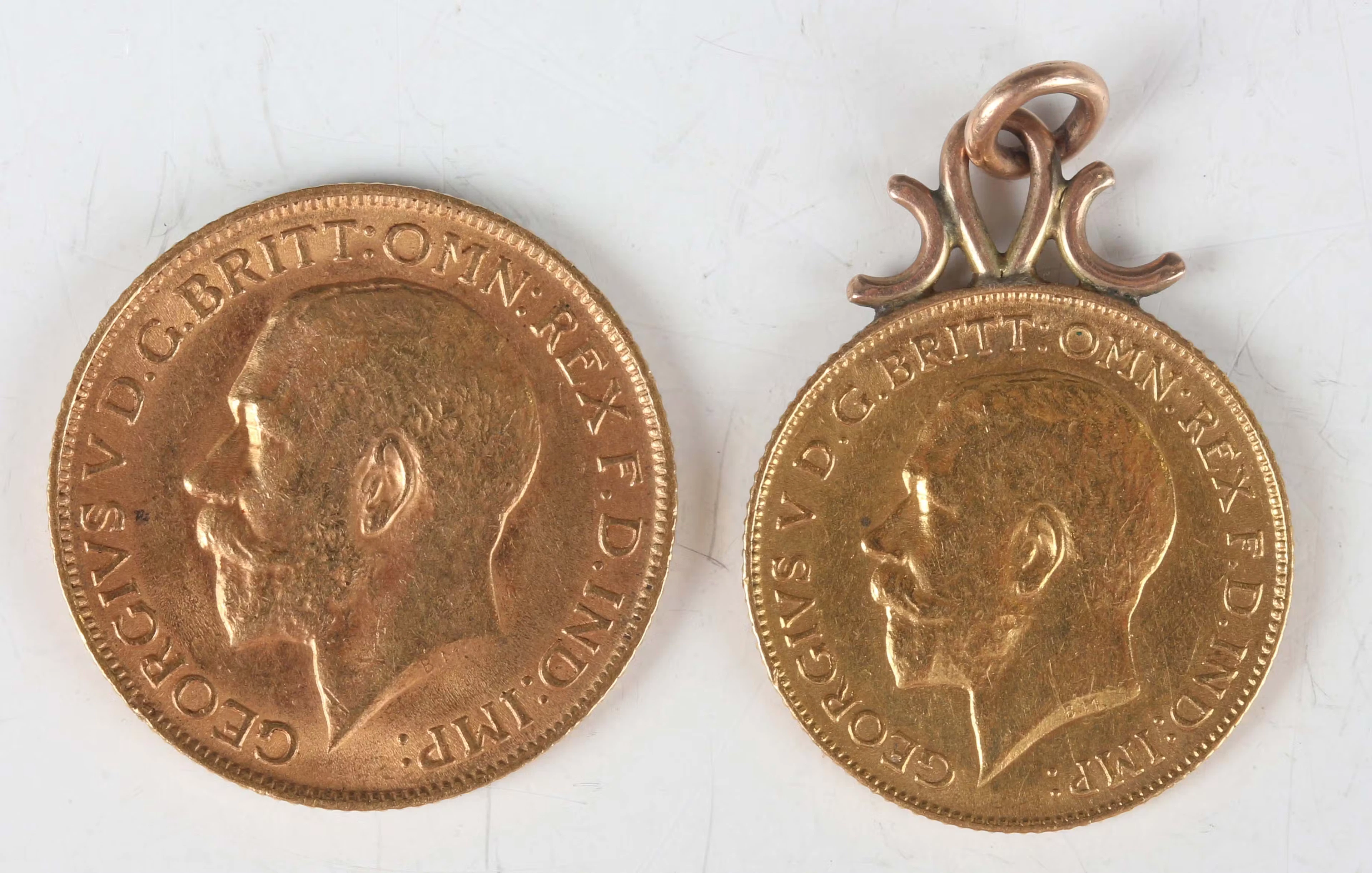A George V sovereign 1911, together with a George V half-sovereign