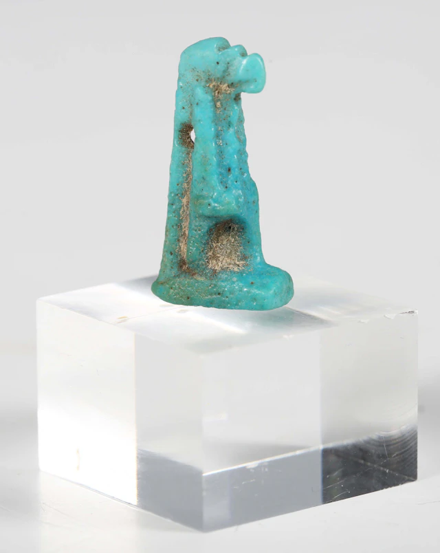 An ancient Egyptian turquoise faience amulet, representing the god