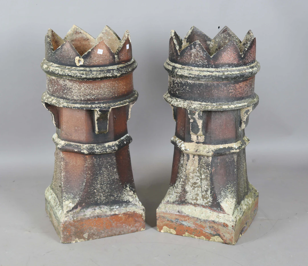 A pair of late 19th/early 20th century chimney pots with castellated