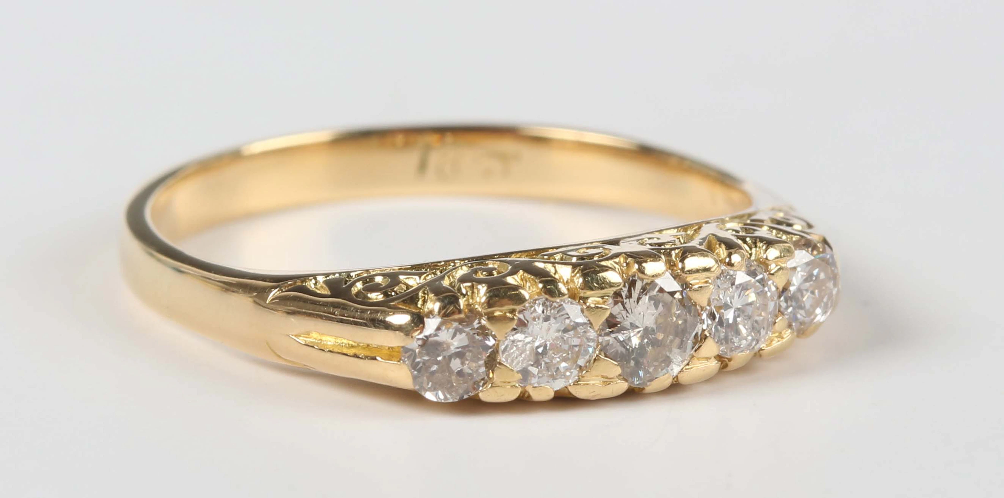 A gold and diamond five stone ring, mounted with a graduated row of