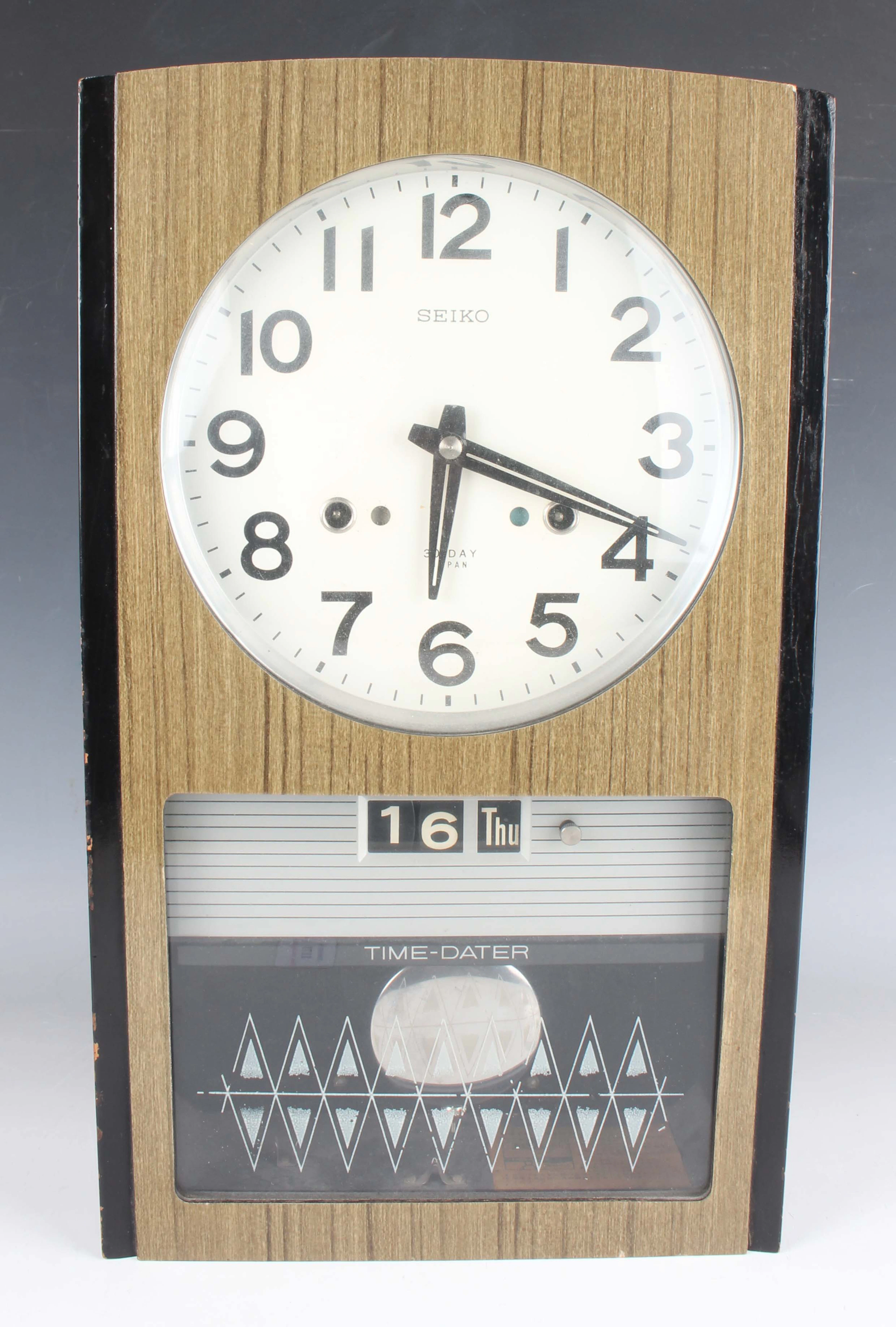 A Seiko Time-Dater wall clock, circa 1960s, with thirty day movement