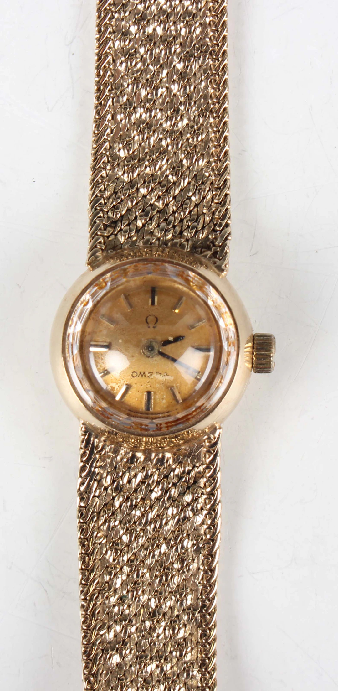 An Omega 9ct gold lady's bracelet wristwatch with signed and jewelled