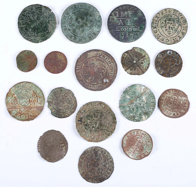A collection of 14th century and later jettons and tokens, including