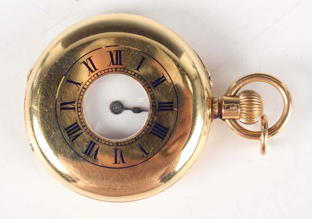 An 18K gold half-hunting cased pocket watch with unsigned jewelled