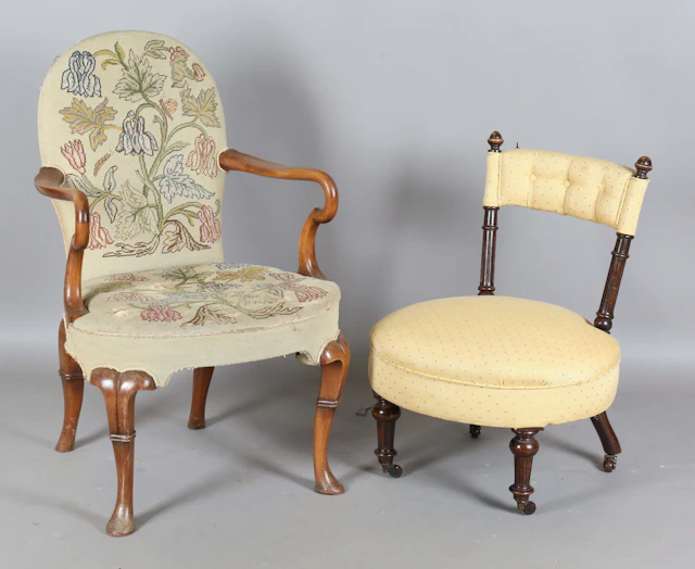 An early 20th century Queen Anne style walnut framed elbow chair with