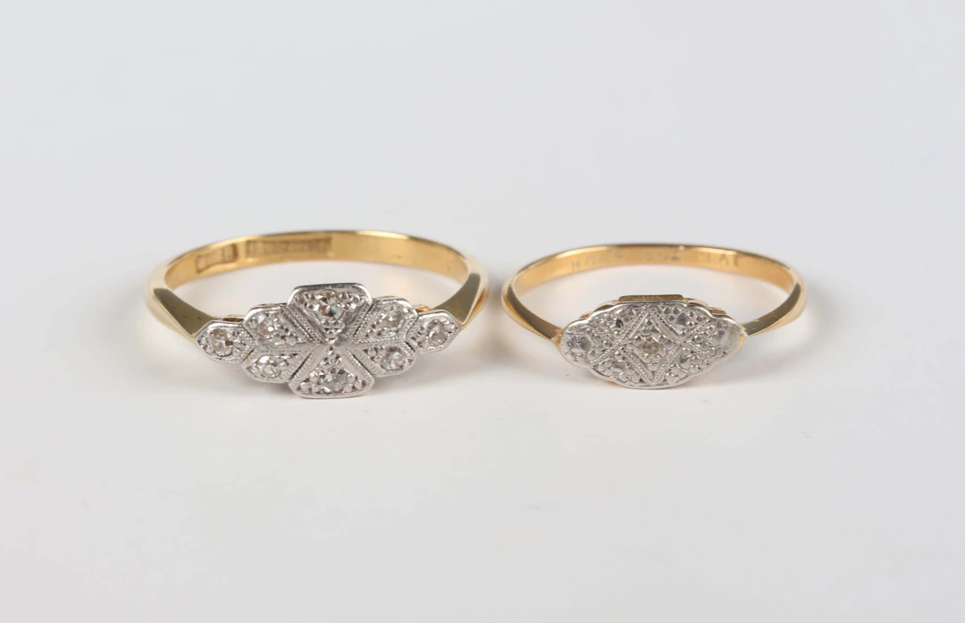 A gold, platinum and diamond eight stone ring, mounted with single
