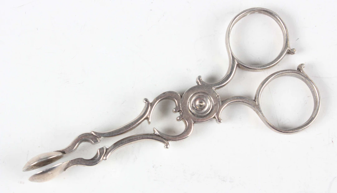 A pair of George III miniature toy silver sugar nips, unmarked, weight