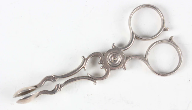 A pair of George III miniature toy silver sugar nips, unmarked, weight