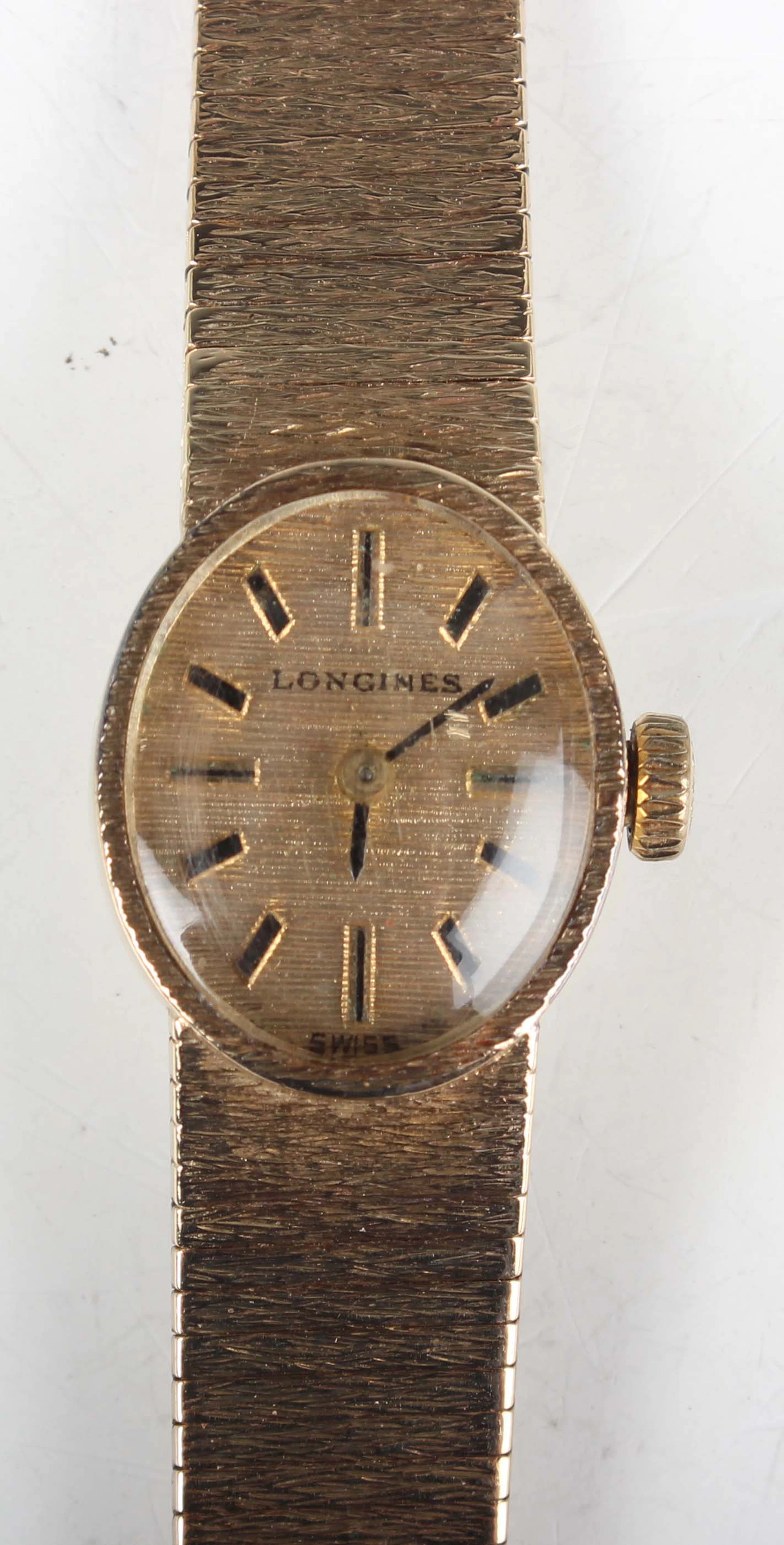 A Longines 9ct gold oval cased lady's bracelet wristwatch with signed