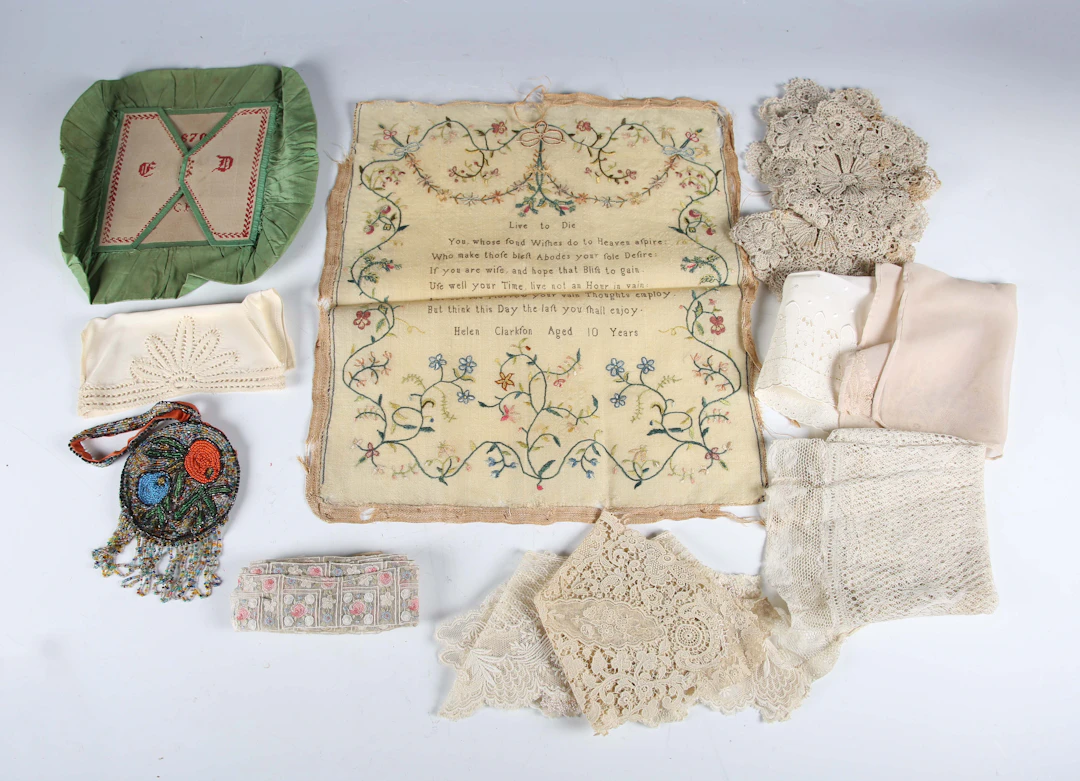 A small group of textiles, including a 19th century needlework sampler
