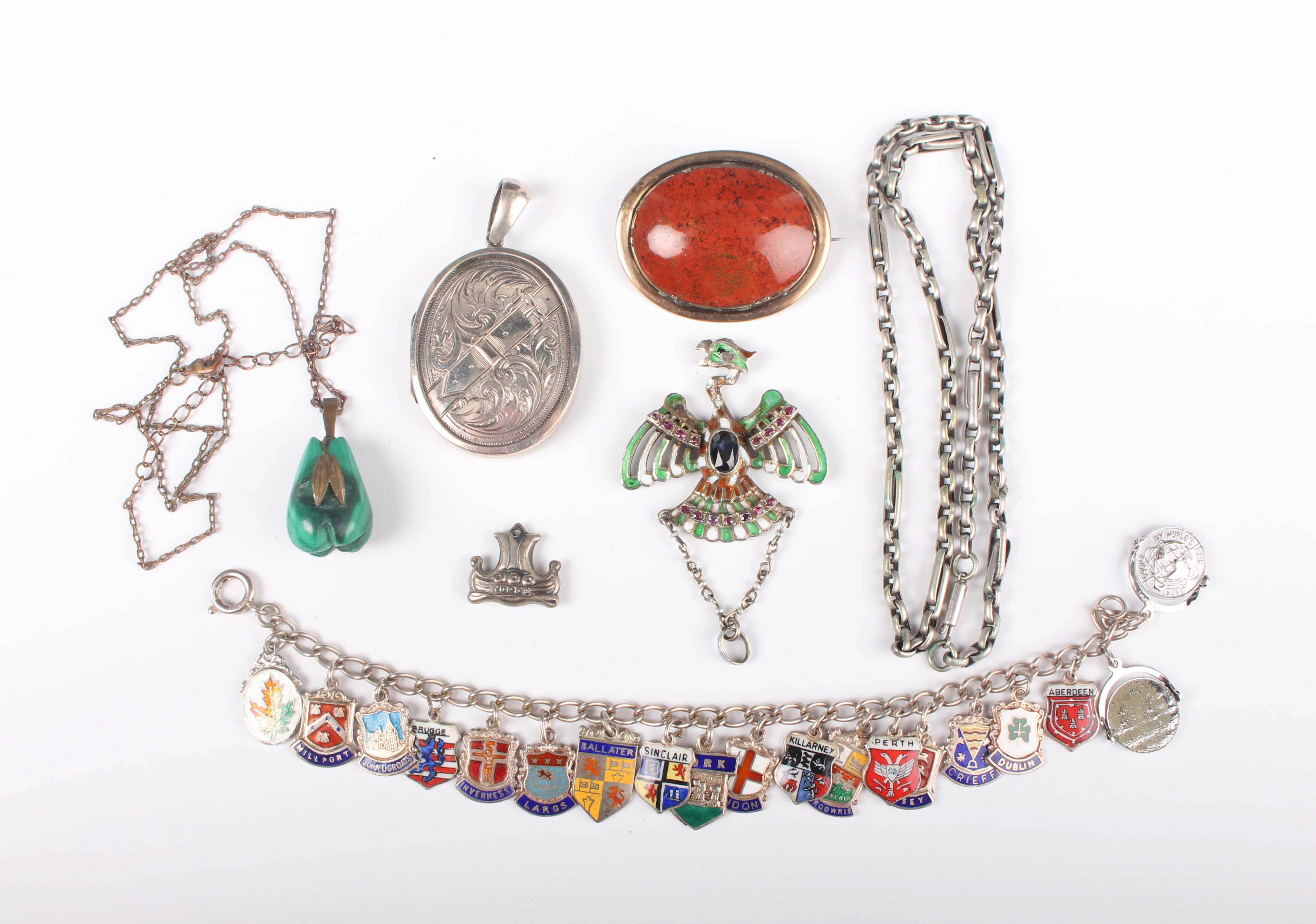 A silver set, sapphire, ruby and enamelled pendant, designed as a