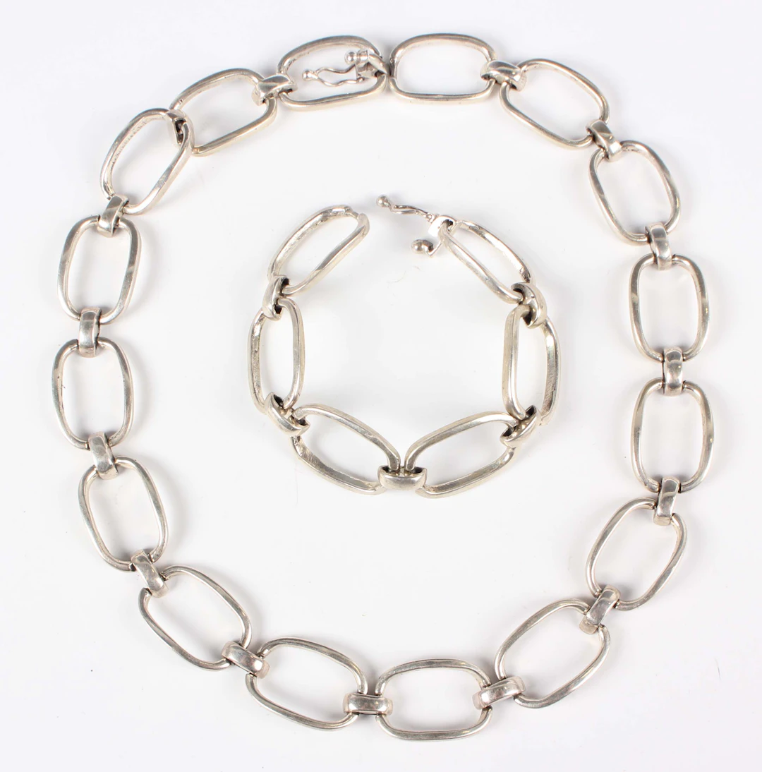 An Egyptian silver necklace in an oval and domed link design, length