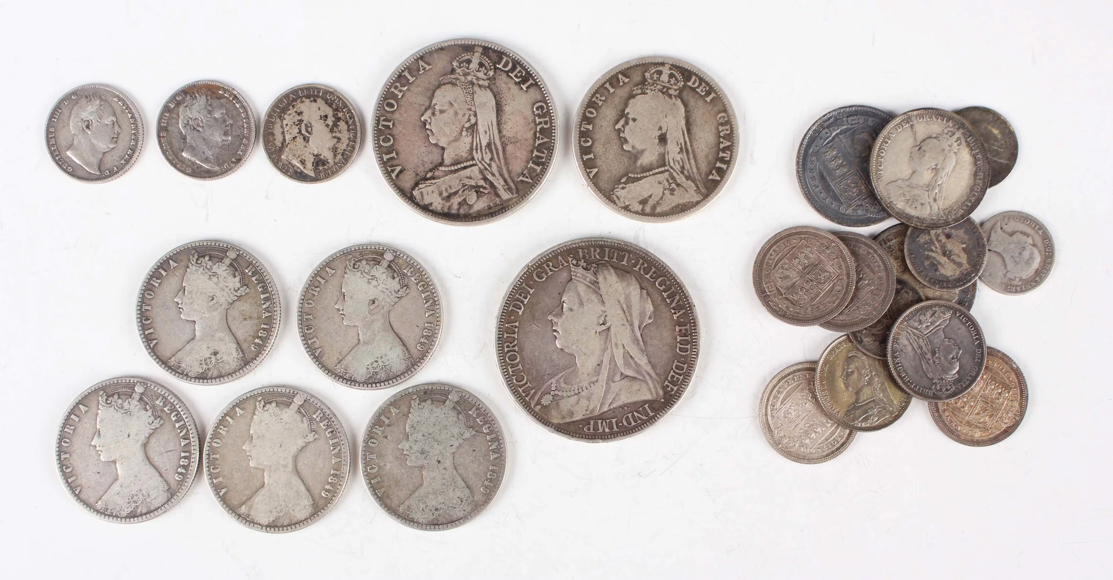 A collection of silver coinage, including a Victoria Veiled Head crown