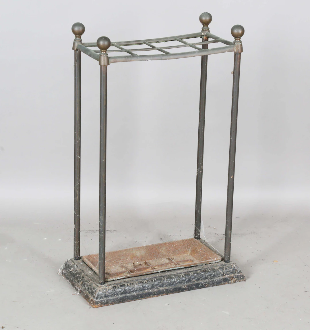 An early 20th century copper and cast iron eight-division stick stand