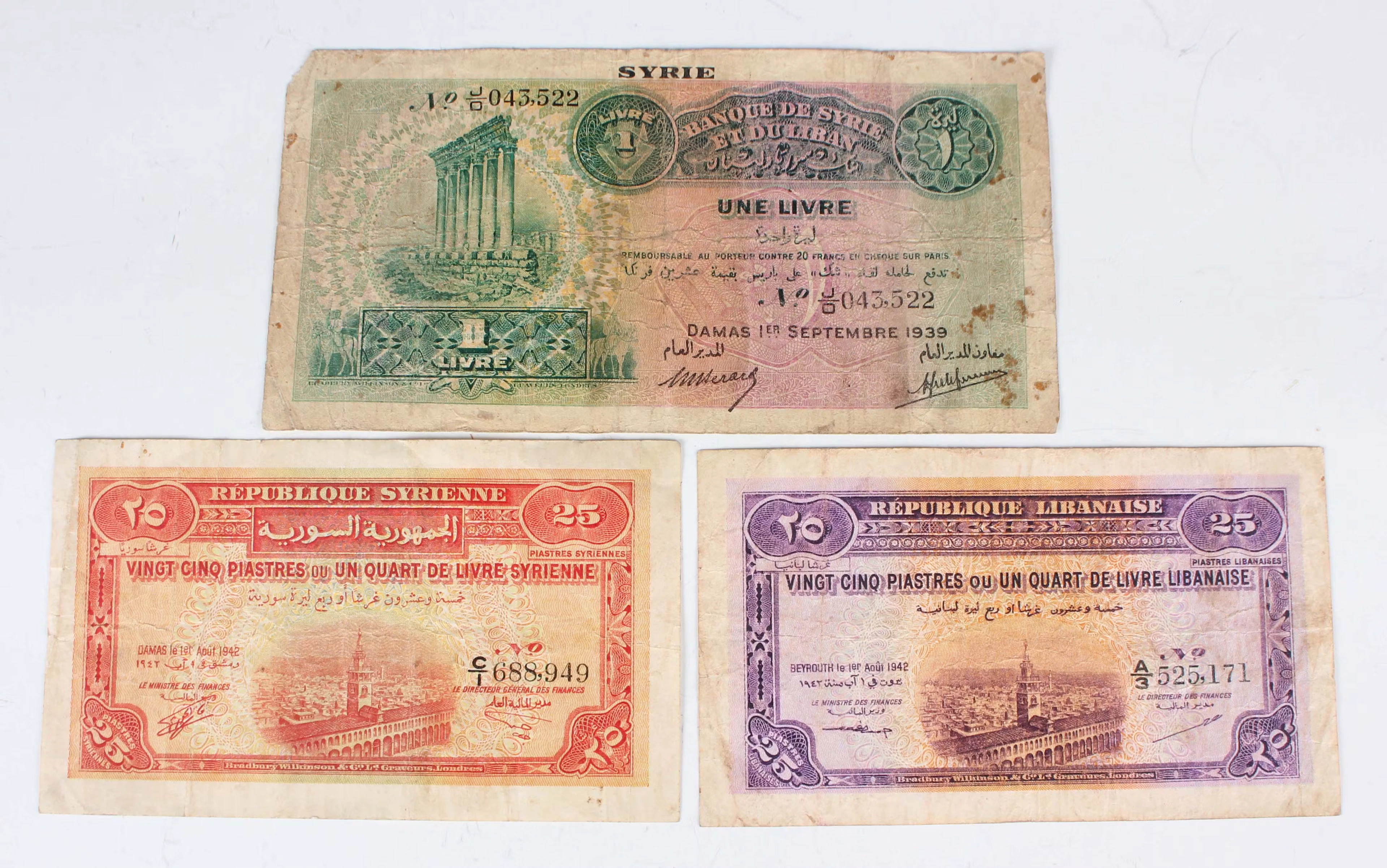 A collection of Syrian and Lebanese banknotes, including a Republic