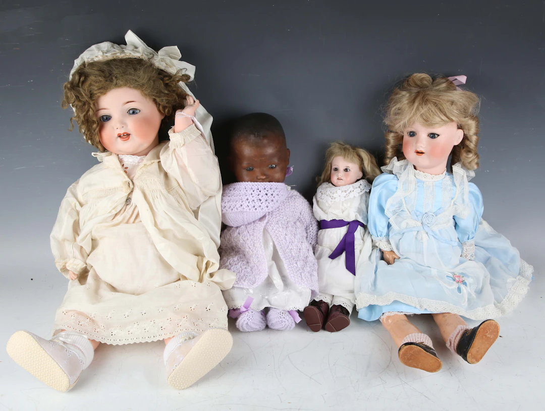 An Armand Marseille bisque head and shoulders doll, impressed '32'00
