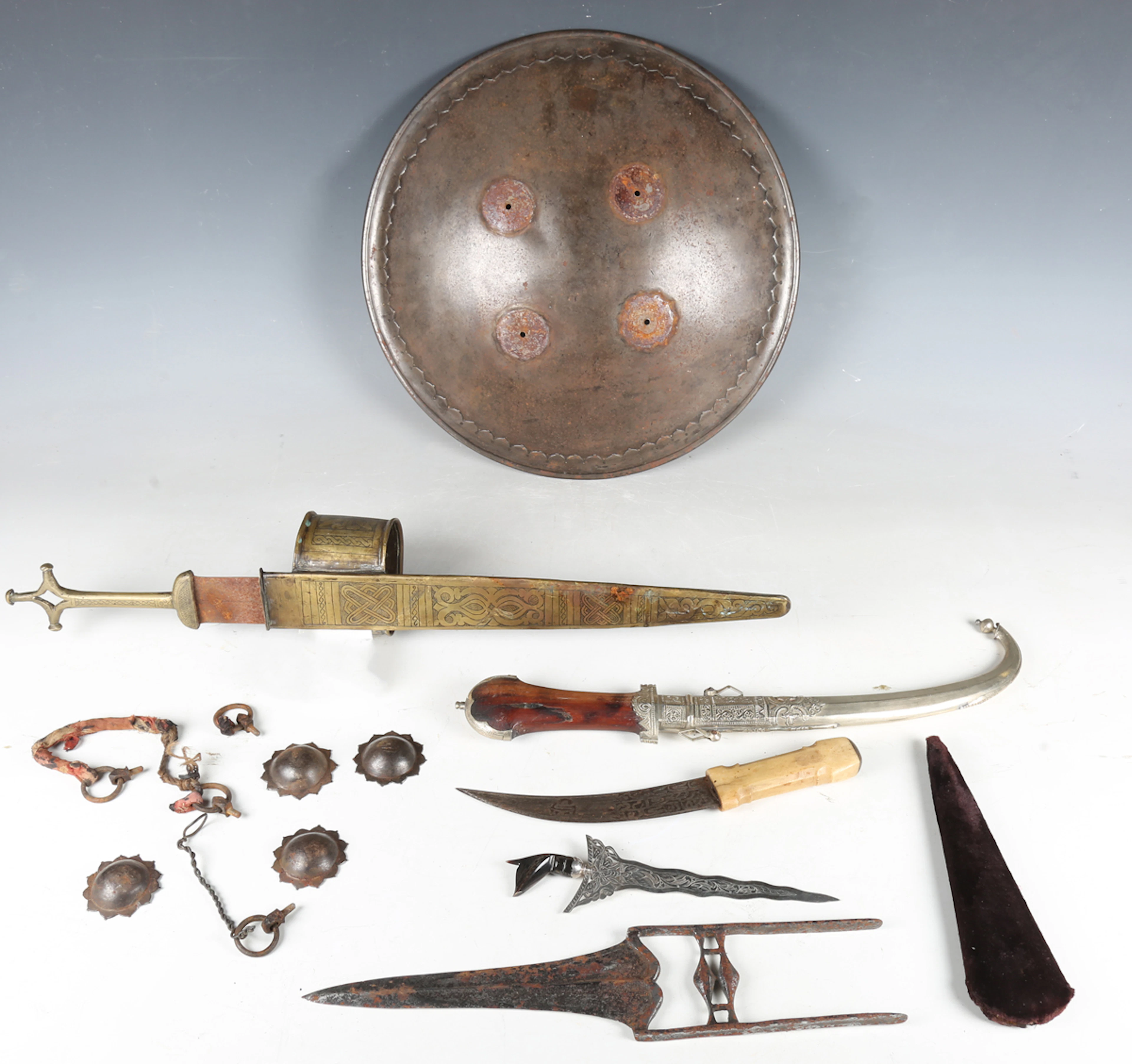 A small group of edged and other weapons, including a Sudanese leg