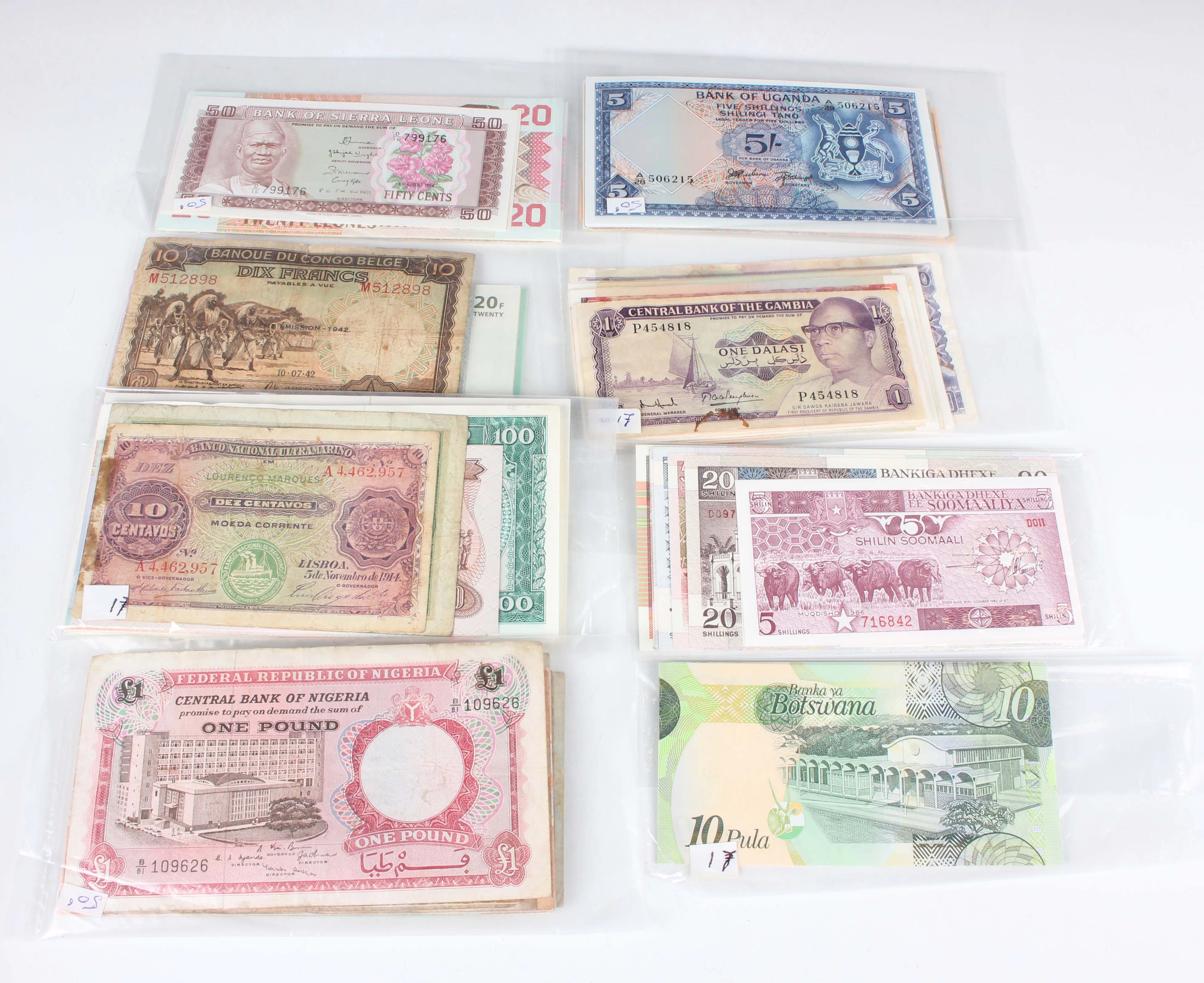 A large collection of African banknotes, including Uganda, Gambia
