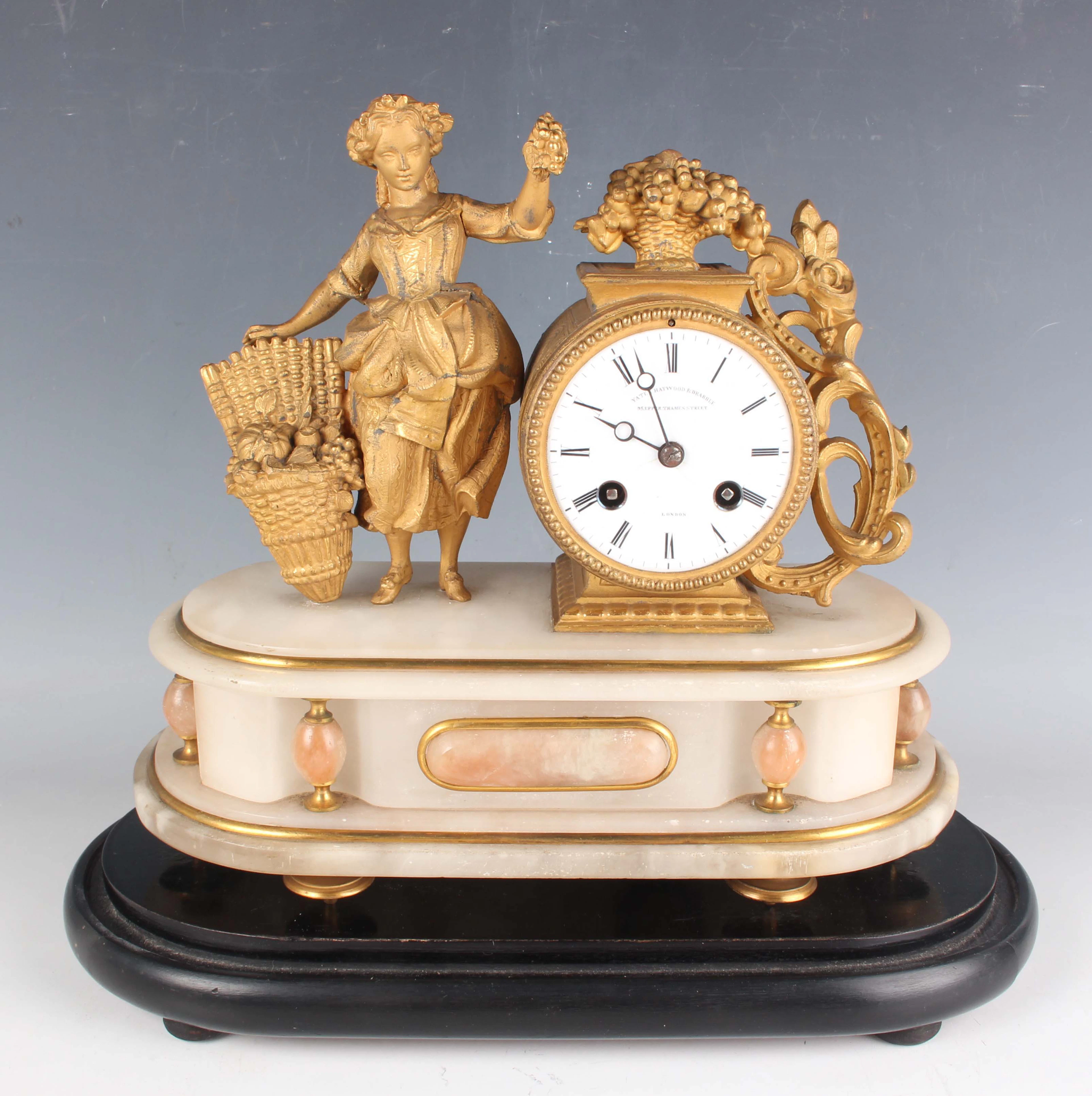 A late 19th century French gilt spelter and alabaster mantel clock